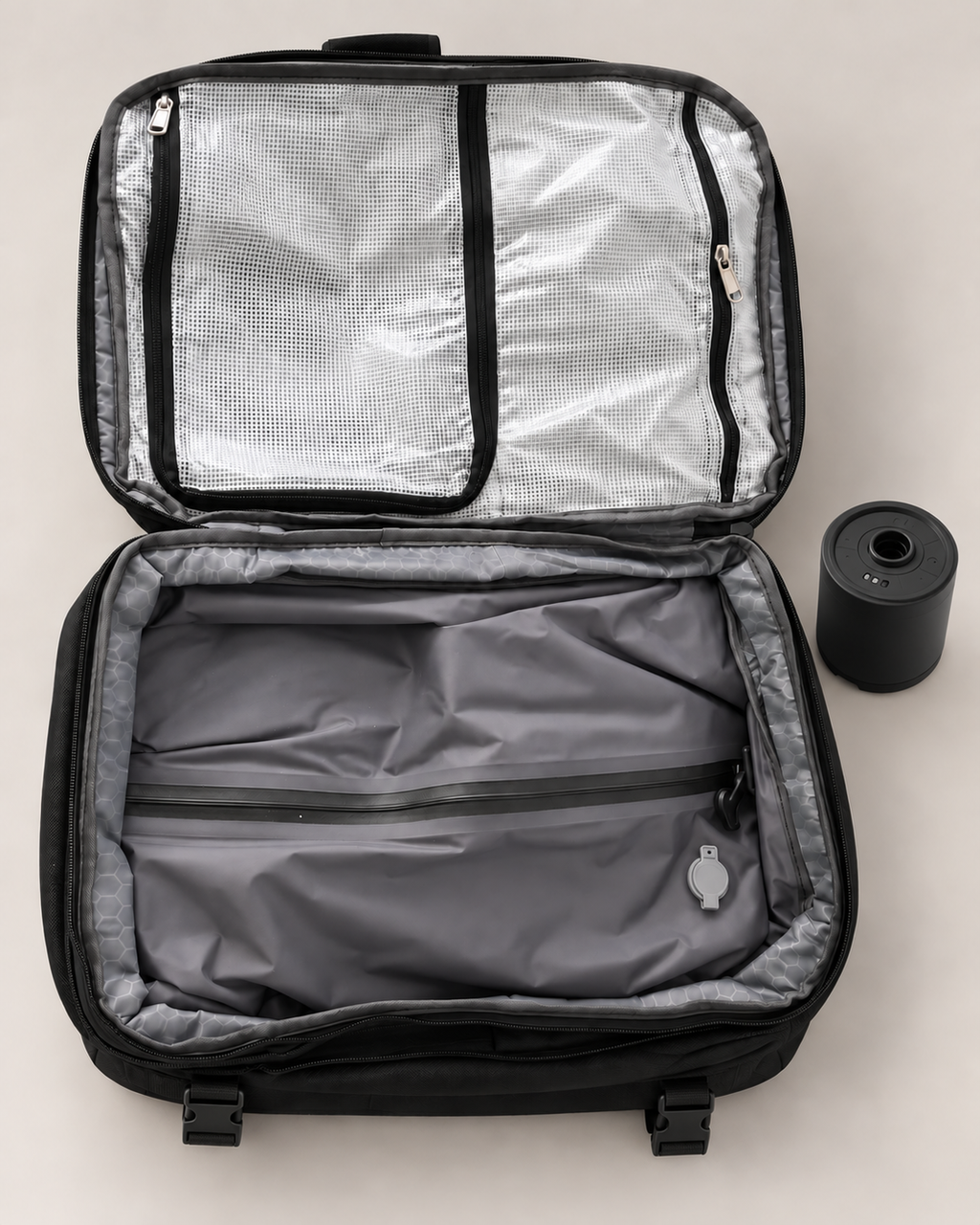 Open STOWD ONE backpack with the included electric vacuum pump